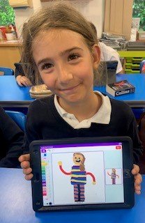 Child creating portrait for tea towel