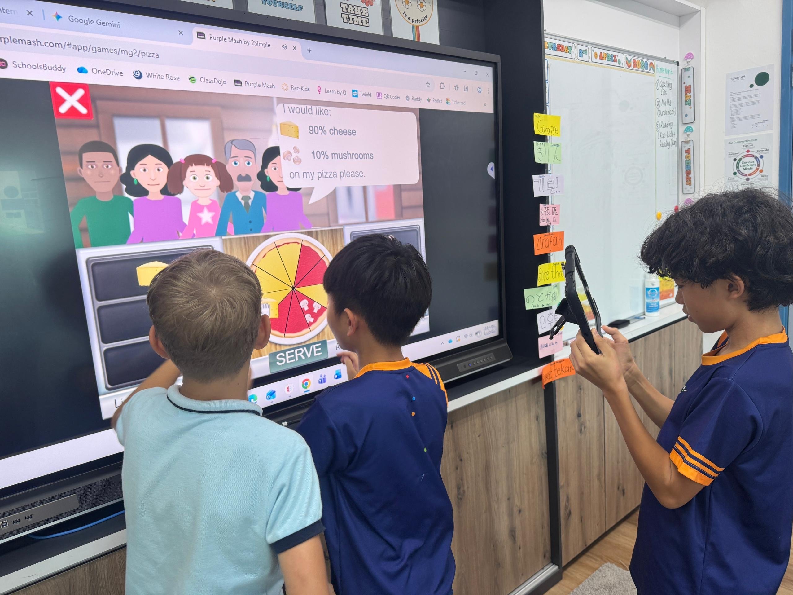 Tenby School Penang Students using the whiteboard with Purple Mash